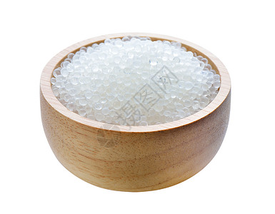 白色背景木碗中的硅胶干燥剂水晶湿度吸收颗粒反射粒状聚合物控制蓝色背景