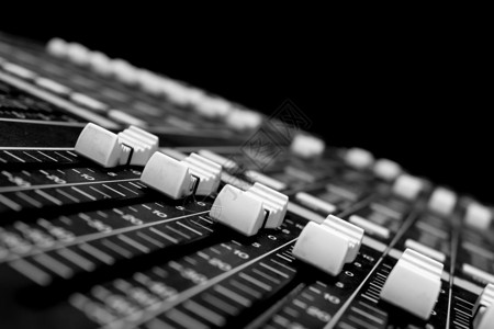 推子特写专业音频混合控制台打碟机工程师工作室娱乐控制板技术桌子调音台音响混合器背景