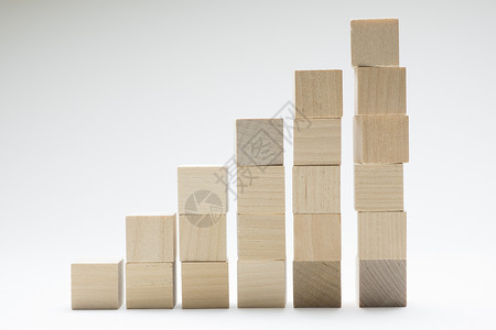 木块拼合图形商业概念增长的成功过程 使用木块堆叠起来背景