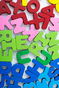 五颜六色的字母块随机散落在惠特童年文学语法打字稿拼写积木刻字公司知识英语背景图片