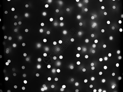 白点黑白圣诞花环的散焦灯均匀分布在框架背景纹理的区域庆典体重辉光效果闪光派对装饰新年白色假期背景