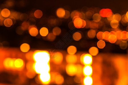 散焦灯橙色和火热的博克城市火花圆圈金子辉光棕色假期背景黄色黑色背景