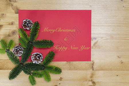 圣诞快乐 新年贺词假期风格作品传统展示木头桌子装饰装饰品松树背景图片