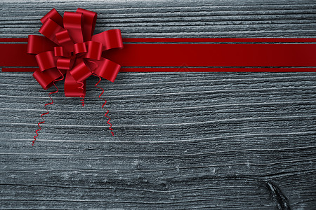 红色圣诞礼章和丝带的复合图像绘图展示灰色木头时候木板计算机礼物庆典假期背景图片