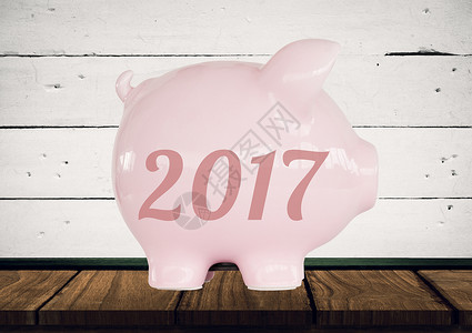 2017年猪肉银行数字组合木头木板制品经济学概念粉色白色桌子陶瓷经济背景图片