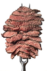 牛排叉白背景的牛排切片牛肉红色白色食物金属肋眼石头倾斜屠夫烧烤背景