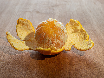 纳吾肉孜节木制桌上的橘子食物甜甜圈台面热带水果来者称道壁画素食者背景