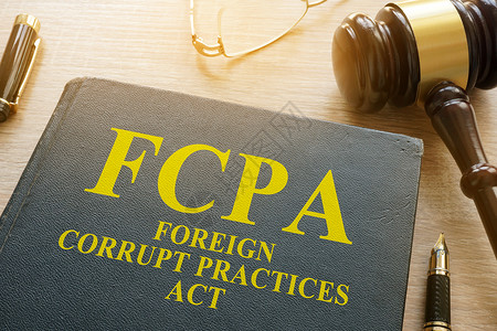 国际法律FCPA 外国腐败行为法 在办公桌上背景