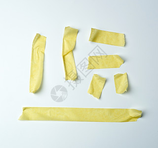 白色胶带一组黄色粘胶纸带的多块片段办公室别针收藏包装贴纸管道标签白色绷带工具背景