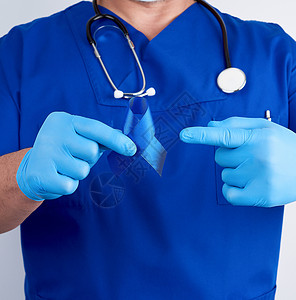 右侧耻骨直肠肌穿蓝制服的医生和不消毒的乳胶手套有黑发炎药物预防帮助男人幸存者世界机构诊所丝带治疗背景