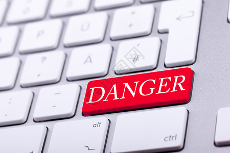 红色高端三折页高端铝键盘 上面写着危险字的红字网络红色控制界面投资失败安全警报钥匙电子邮件背景