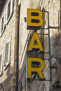 栏符号店铺餐厅建筑黄色销售石头背景图片