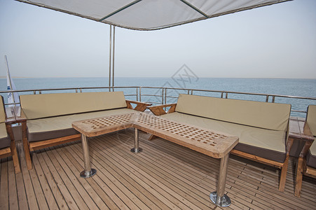 缅甸柚木家具豪华汽车游艇甲板上的桌椅软垫巡航柚木奢华海洋家具木头地平线娱乐假期背景