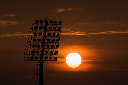 新时达日出时有运动灯黑色环境红色体育场橙子日落力量黄色天际城市背景