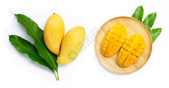 黄色芒果白背景有叶子的芒果果汁甜点营养美食饮食维生素异国季节情调热带背景