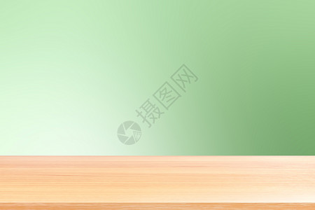 美丽的鸟桌面渐变绿色软背景上的空木桌地板 木桌板空前彩色渐变 浅绿色渐变上的木板空白 用于展示产品或横幅广告背景