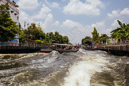 泰国的曼谷河旅行组织文化运河旅游传统城市景观速度运输城市生活访问背景图片