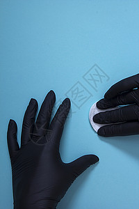 手戴黑色硝酸胶手套蓝色医疗白色药品棉绒橡皮展示外科安全保健背景