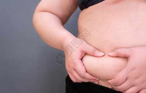 肥胖妇女 形成健康的胃肌肉和饮食健康高清图片