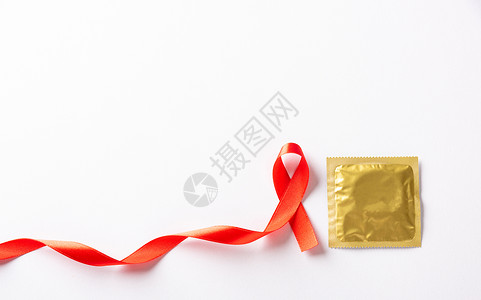 红色避孕套艾滋病毒 艾滋病癌症认识和避孕套的红领带标志环形机构丝绸活动蓝绿色预防生活徽章丝带控制背景
