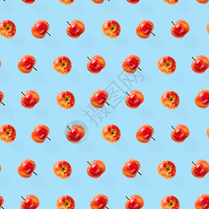苹果抽象素材无缝模式与成熟的苹果 热带水果抽象背景 苹果在蓝色背景上的无缝模式红色饮食绿色图案食品宏观维生素纤维营养减肥背景