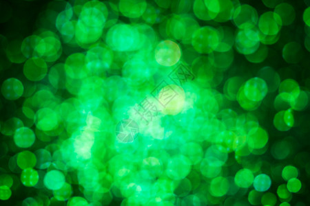 绿灯抽象bokeh背景 克莉丝玛光散景火花假期彩灯庆典绿色圣诞色彩背景图片