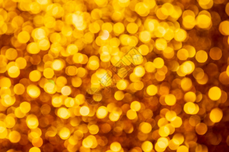 金色灯光抽象bokeh背景 基督教灯光闪耀彩灯散景庆典圣诞色彩假期火花黄色背景图片