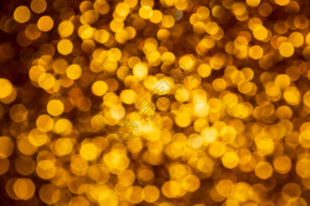 金色灯光抽象bokeh背景 基督教灯光闪耀散景圣诞庆典彩灯黄色火花假期色彩背景图片