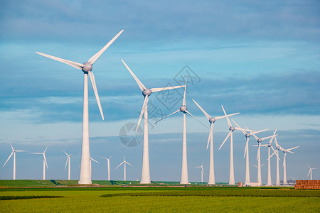 旋转风车用于电力生产的风车荷兰弗莱福兰 海上风力涡轮机农场 生产绿色能源的风车农场技术螺旋桨蓝色力量植物活力旋转发电机全球环境背景