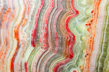 红色大理石多彩多姿的石头花岗岩大理石macr的纹理背景