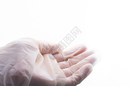 为保护而手戴保护手套 佩戴不育的乳胶防身手套病人职员流感手术疾病安全考试实验室医生护士背景