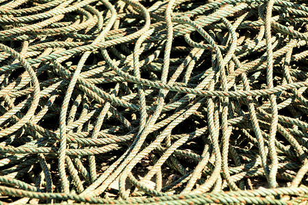 港口的绳索纹旋转环形工业绑扎建筑乐器海洋绞刑架水手电缆背景图片