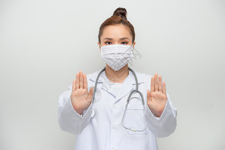 不带钱出门戴着医用面具 白大衣停下来 十字标志 禁止出门的严肃亚洲女医生背景