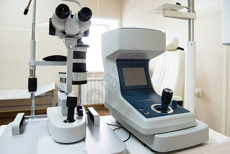 综合验光仪现代医疗设备视网膜乐器激光镜片工作电脑房间研究眼睛光学背景