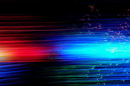 动态粒体深色背景上的抽象运动弧形灯小径流动蓝色速度踪迹曲线力量线条纤维彩虹背景