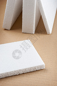 白色泡沫质体包装吸收震惊材料损害纸板商品货运粮食墙纸背景图片
