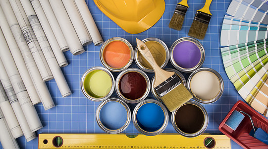 油漆设备五颜六色的油漆罐滚筒车轮装修工作画笔绘画房子染色地面刷子背景