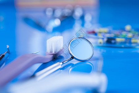 保健 病理学设备 牙科概念镜子牙齿健康白色技术金属牙医治疗医生乐器背景图片