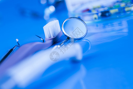 保健 病理学设备 牙科概念牙齿矫正治疗技术镜子白色金属医生工具乐器背景图片