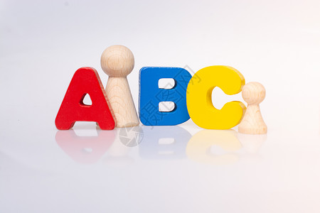 字母abcABC和Wooden将人的图象作为家庭概念人人男性父亲公司妈妈女孩生活女儿乐趣保险背景