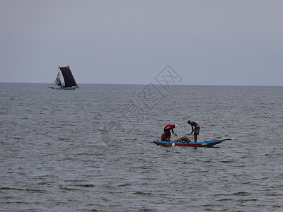 双体帆船（斯里兰卡Negombo海岸的捕鱼渔船天空双体航行帆船假期钓鱼渔民海滩旅游景点背景