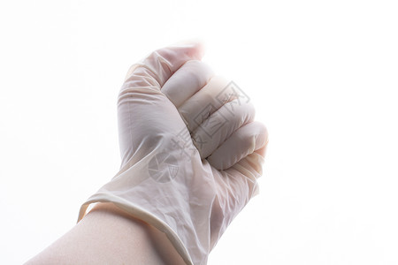 为保护而手戴保护手套 佩戴不育的乳胶防身手套传染性流感疾病实验室感染医生安全卫生手术橡皮背景
