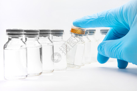 白种一瓶疫苗剂量白种背景的一瓶疫苗蓝色玻璃白色剂量治愈实验室医院流感制药解药背景