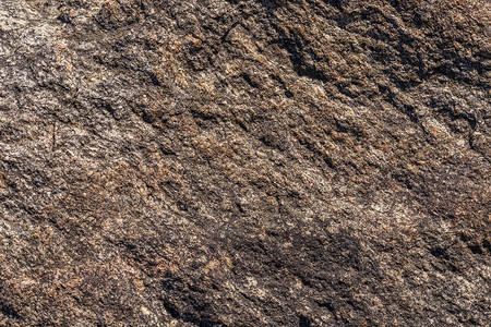 直射阳光下的石材表面纹理和全框背景太阳宏观矿物棕色灰色材料建筑岩石地质学空白背景图片