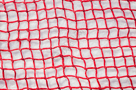 玫红色素材网红色安全网平躺在雪地上背景