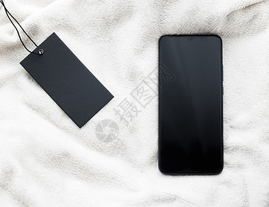手机标签服装标签和手机屏幕作为黑色星期五销售概念 智能手机平板模型作为应用程序模板和品牌营销设计背景