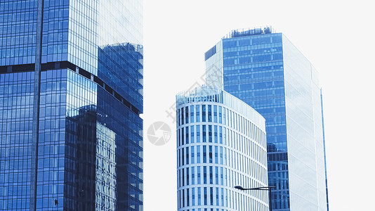 金融区企业办公楼 市中心现代摩天大楼 商业地产业务和当代建筑玻璃公司银行市中心中心住宅反射奢华建筑学蓝色背景图片