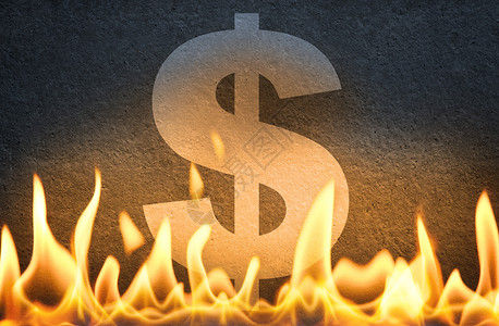 在火焰中燃烧的美元象征物高清图片