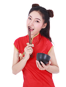 妇女穿着中国青桑服装 用筷子和碗叉成白种面的黑衣女子餐厅女孩食物女士节日美食杯子微笑女性旗袍背景图片