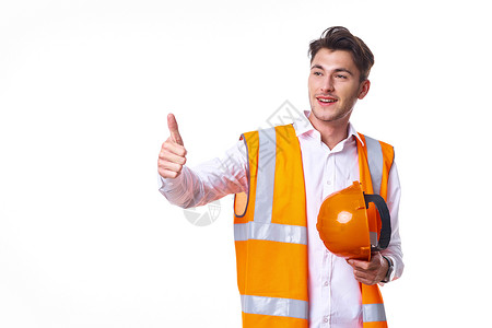 橙色统一制服职业轻背景的员工精神力工作者项目工程安全经理头盔商务帽子领班成人植物背景